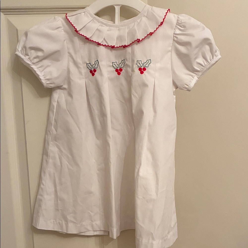 Christmas dress with red trimmed collar and holly embroidery